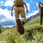 a-group-of-people-with-backpacks-tourists-are-walking-up-the-mountain